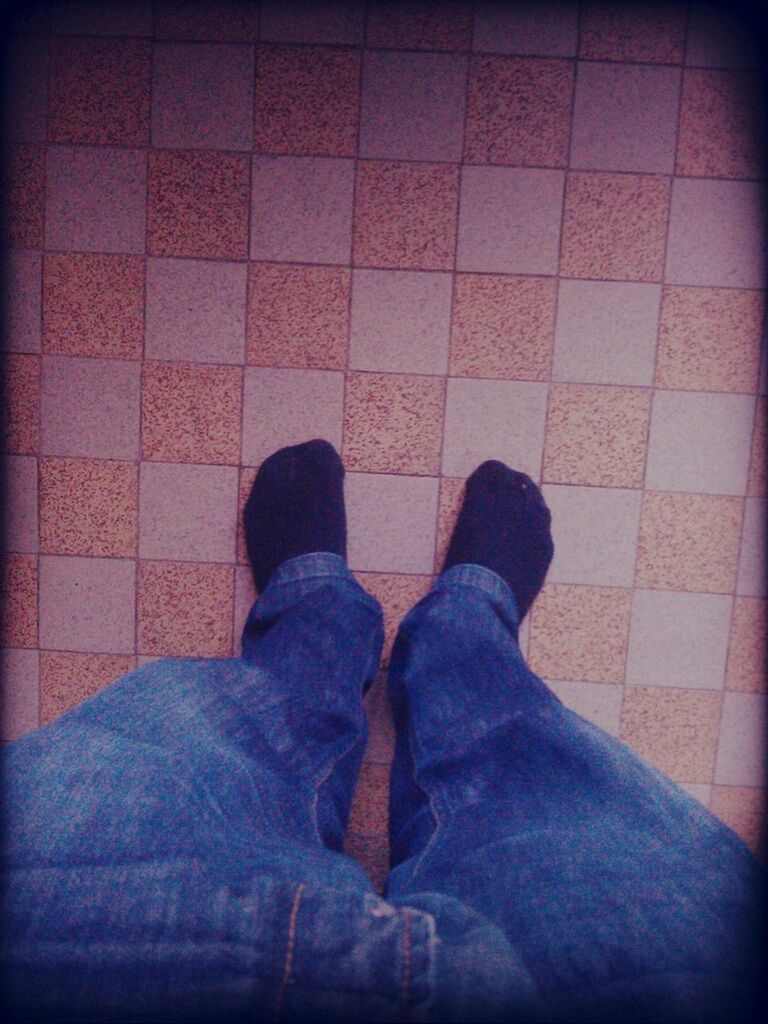 low section, person, shoe, personal perspective, human foot, jeans, high angle view, lifestyles, footwear, standing, indoors, men, tiled floor, unrecognizable person, auto post production filter, leisure activity, flooring