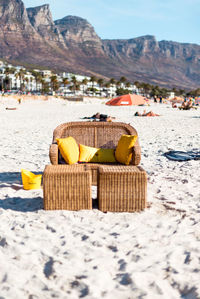 Close-up of yellow toy on beach