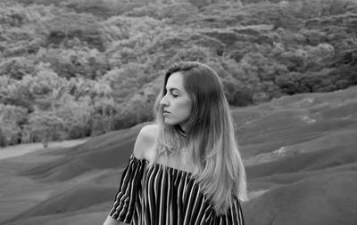 Black and white young girl portrait in chamarel seven coloured earth, mauritius