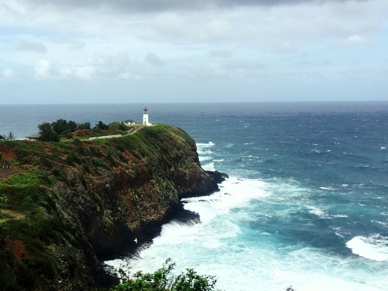 LIGHTHOUSE BY SEA AGAINST SKY