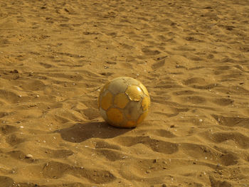 High angle view of soccer ball on beach