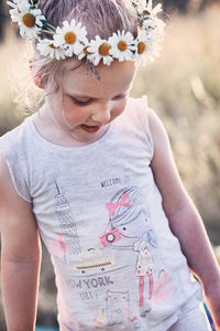 Close-up of cute girl wearing flowers