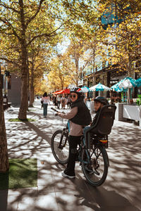 Man riding bicycle on street