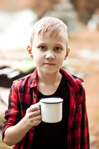 Portrait of of boy drinking hot chocolate