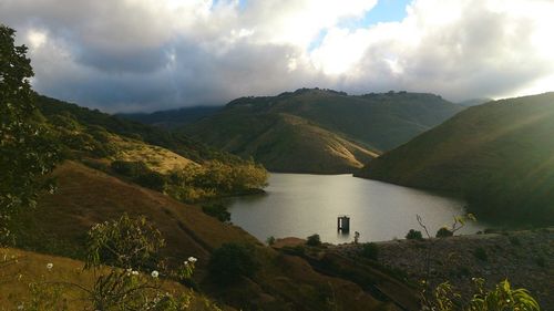 Panoramic view of lake against cloudy sky