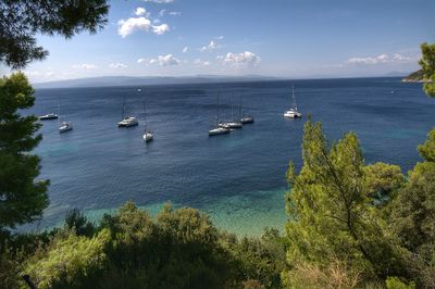 High angle view of boats in calm blue sea