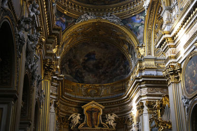 Low angle view of ornate interior in church