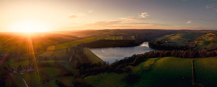 Scenic view of landscape against sky during sunset