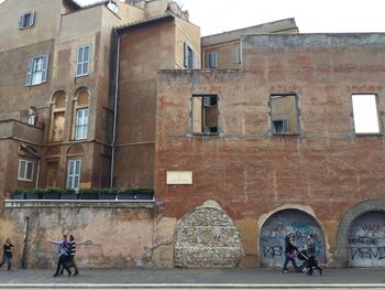 People in front of building