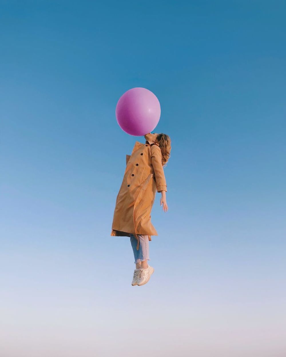 balloon, mid-air, one person, full length, blue, sky, toy, nature, fun, copy space, clear sky, childhood, child, emotion, happiness, women, flying, adult, carefree, day, motion, helium balloon, positive emotion, holding, casual clothing, jumping, joy, clothing, outdoors, sunny, pink, enjoyment, female, leisure activity, person, standing, vitality