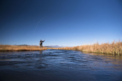 A fly fisherman on the upper owens river.