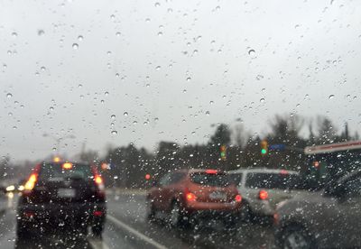 Road seen through wet window