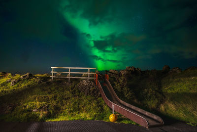 Scenic view of landscape against sky at night