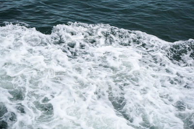 High angle view of surf on beach