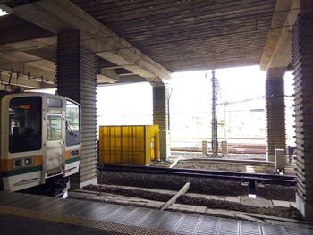 Train at railroad station against sky