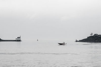 Boat sailing in sea