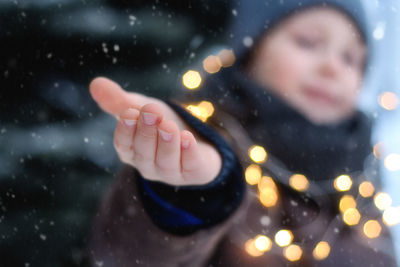 Midsection of child during rainy season