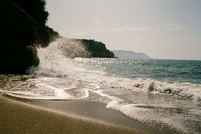 Scenic view of beach against clear sky