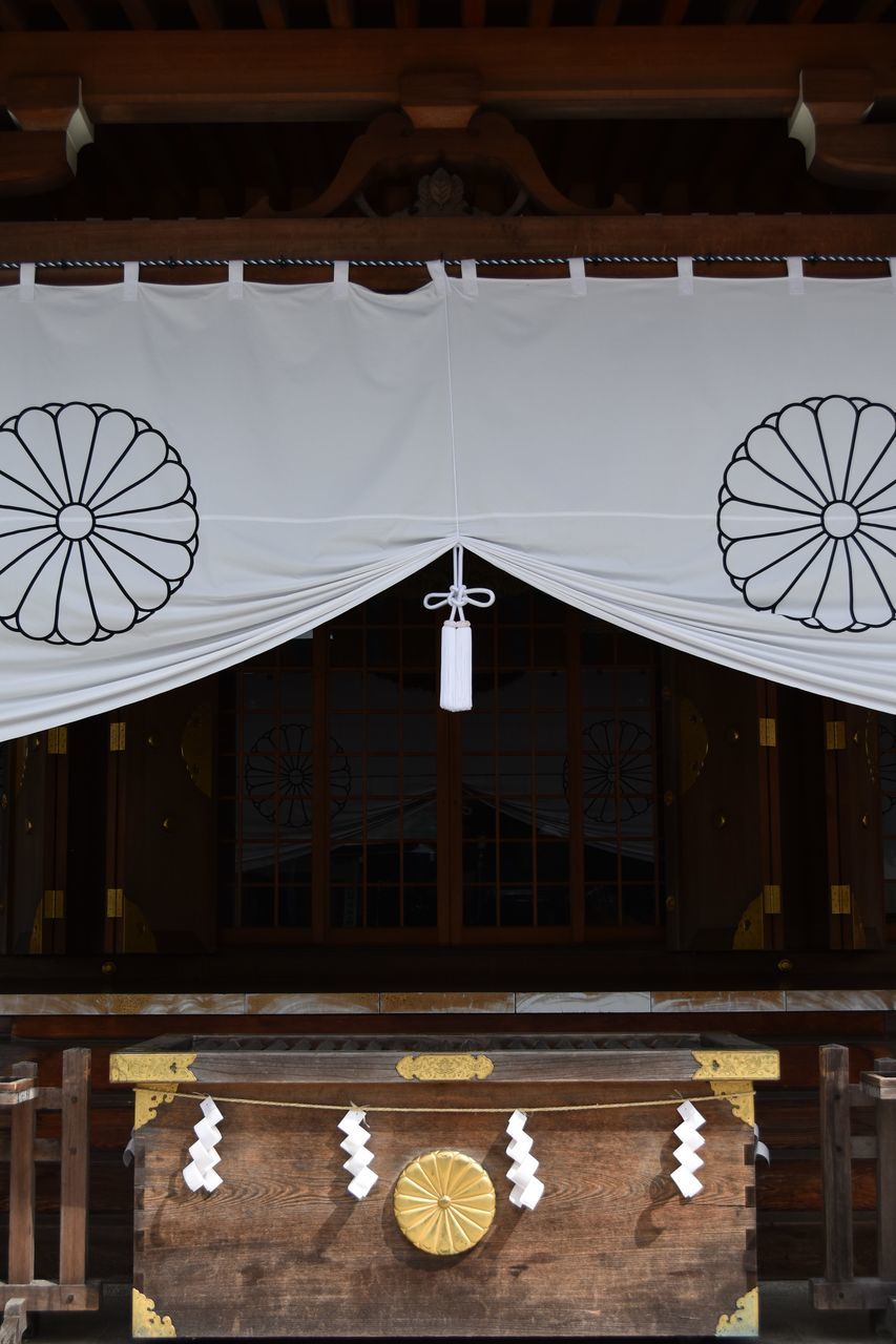 architecture, built structure, building exterior, no people, place of worship, art and craft, low angle view, religion, pattern, belief, wood - material, creativity, spirituality, building, hanging, lighting equipment, day, design, ceiling, floral pattern