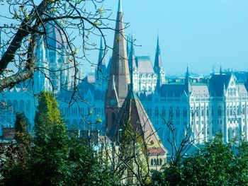 Low angle view of buildings against blue sky