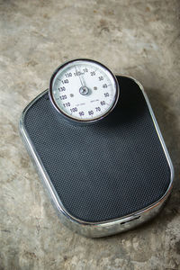 High angle view of weight scale on floor 