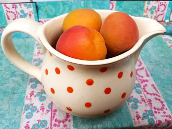 Close-up of fruits in cup on table