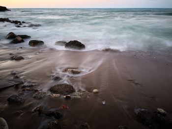 Scenic view of beach against sky