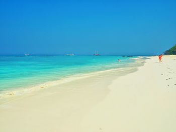 View of beach against blue sky