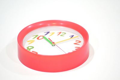 High angle view of clock on white background