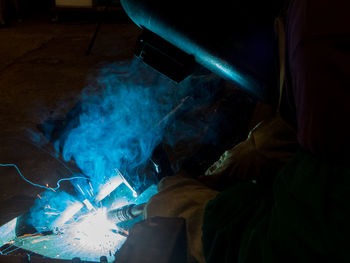 Side view of man working in factory