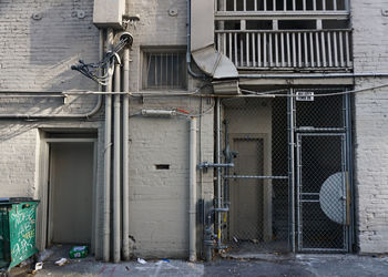 Closed door and ducting in alley