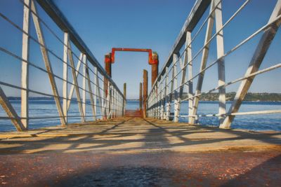 View of bridge over sea against clear sky