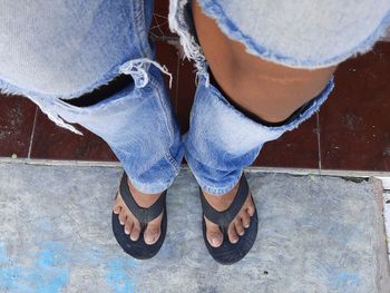 Low section of woman standing on floor