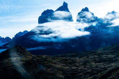 Scenic view of snowcapped mountains against sky