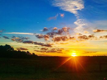 Scenic view of sunset over landscape