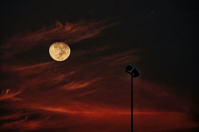 Low angle view of moon against sky at night