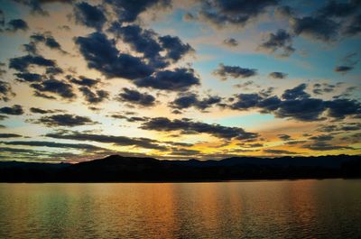 Scenic view of mountains against cloudy sky