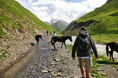 Man looking at mountains