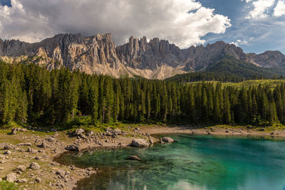 Lake carezza is a small alpine lake in the dolomites, italy.