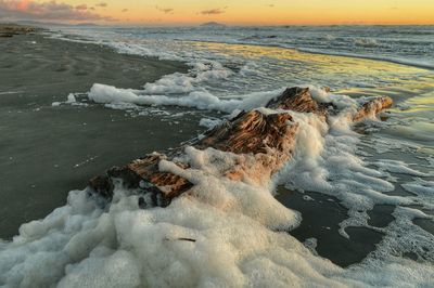 Scenic view of sea at sunset