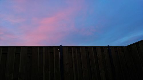 Low angle view of wooden structure against sky