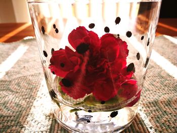 High angle view of red wine in glass on table
