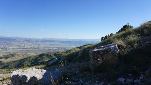 Scenic view of landscape against clear blue sky