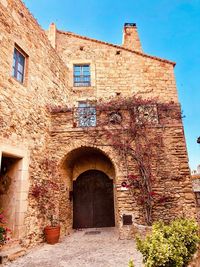 Low angle view of historic building against sky