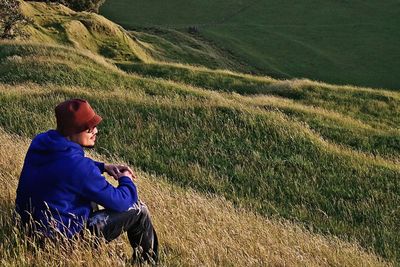 Man sitting on field