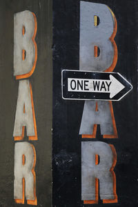 Close-up of information sign on wood