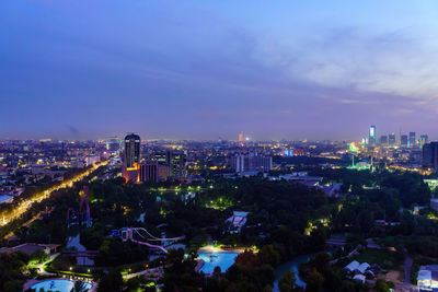 High angle view of illuminated cityscape against sky