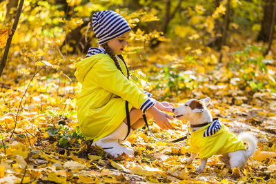 Side view of a dog with umbrella