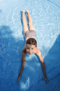 Young woman swimming in pool