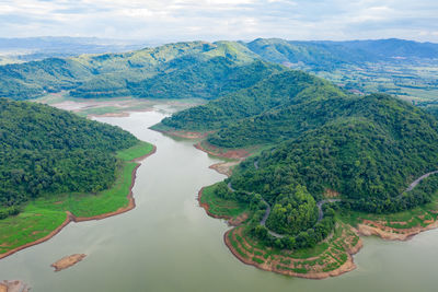 Landscape aerial top panoramic view reservoir dam river and mountain green natural forest 